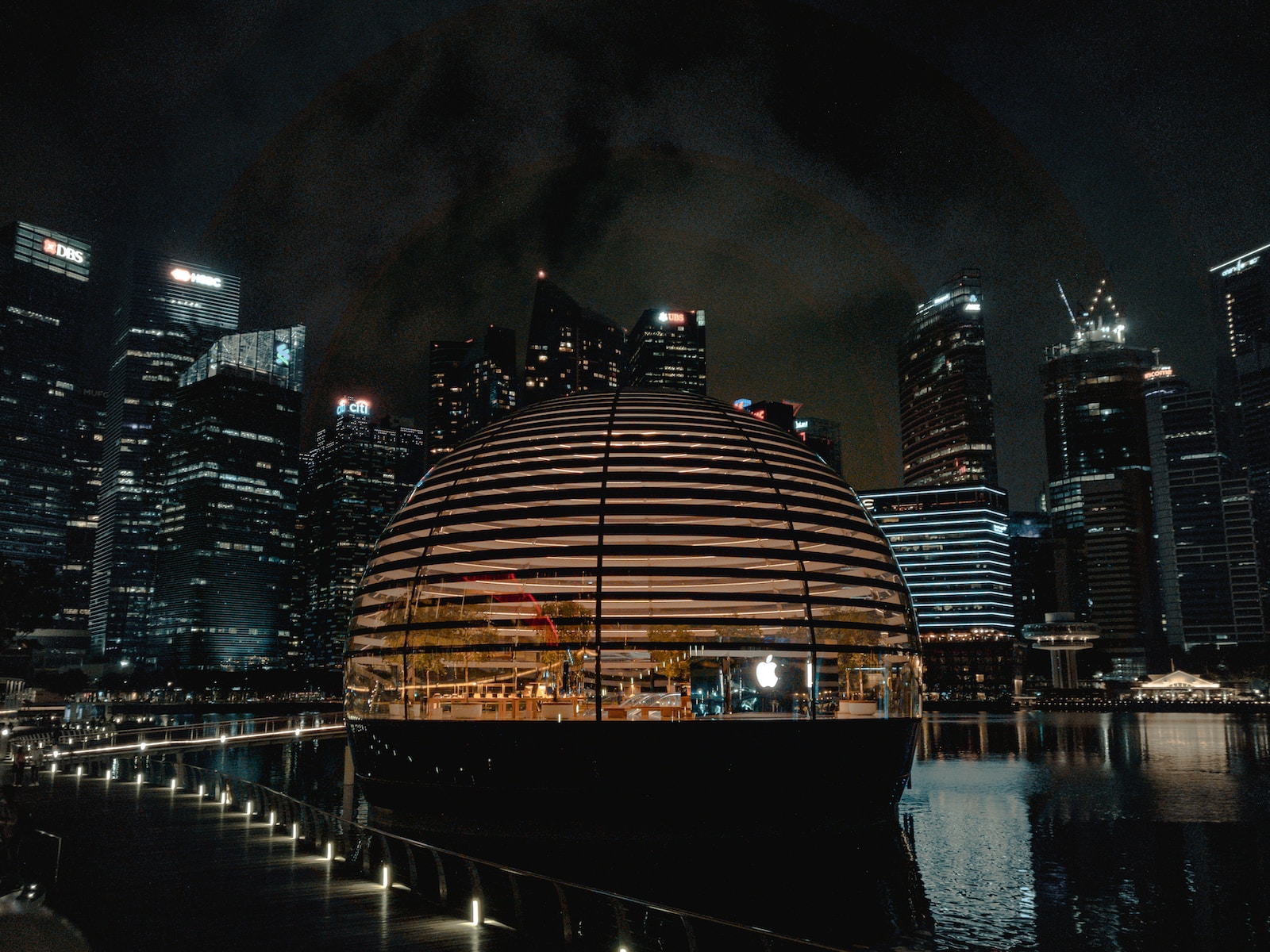 brown and black dome building near body of water during nighttime